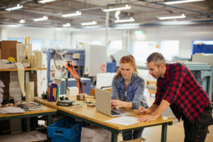 Two people discussing in production print facility